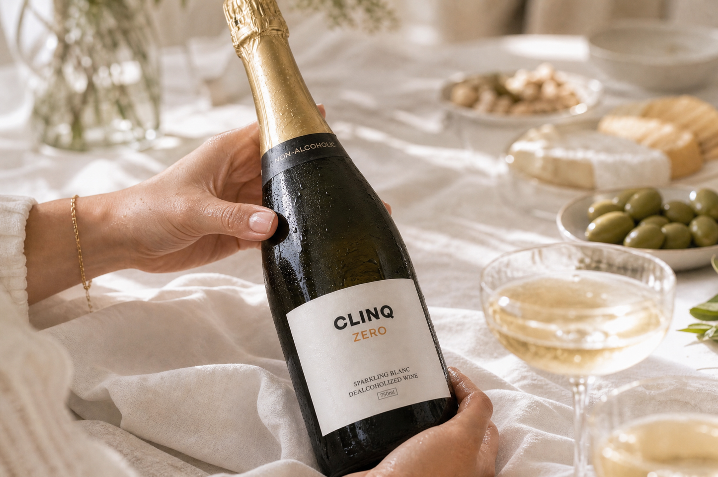 A guest turning the CLINQ ZERO bottle to read the label
