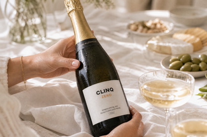 A guest turning the CLINQ ZERO bottle to read the label